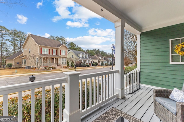 balcony with a residential view and a porch