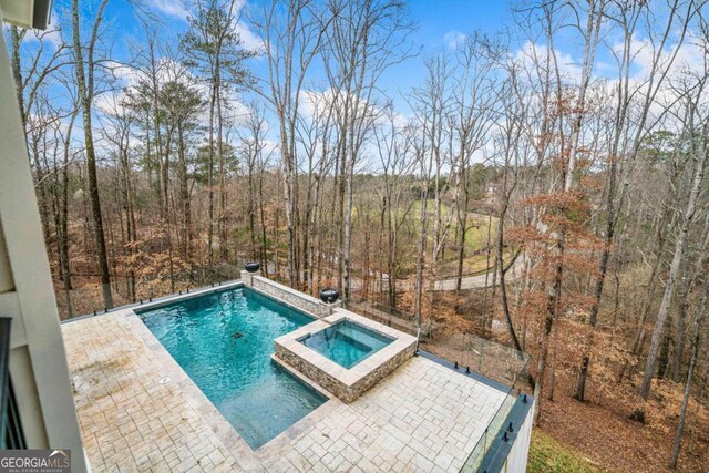 310 Timberview Trl, Alpharetta, GA 30004 - view of swimming pool featuring a patio area and a pool with connected hot tub