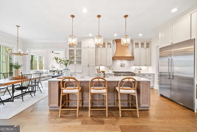 310 Timberview Trl, Alpharetta, GA 30004 - kitchen with light countertops, stainless steel built in refrigerator, custom exhaust hood, and recessed lighting