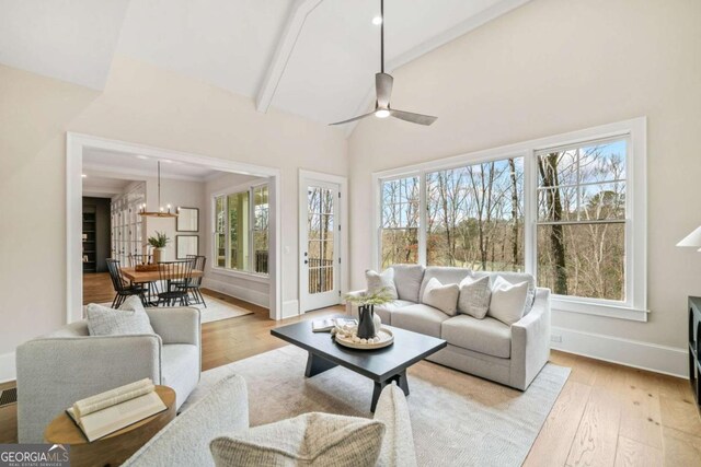 310 Timberview Trl, Alpharetta, GA 30004 - living room with baseboards, wood finished floors, beam ceiling, and a healthy amount of sunlight
