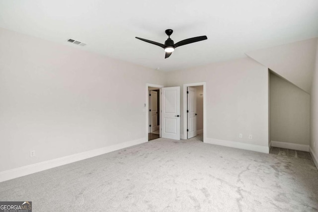 unfurnished bedroom with ceiling fan, carpet floors, visible vents, and baseboards