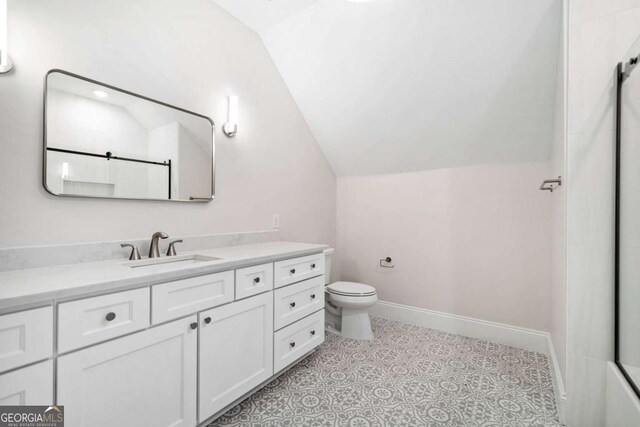 310 Timberview Trl, Alpharetta, GA 30004 - bathroom featuring lofted ceiling, vanity, toilet, and a shower
