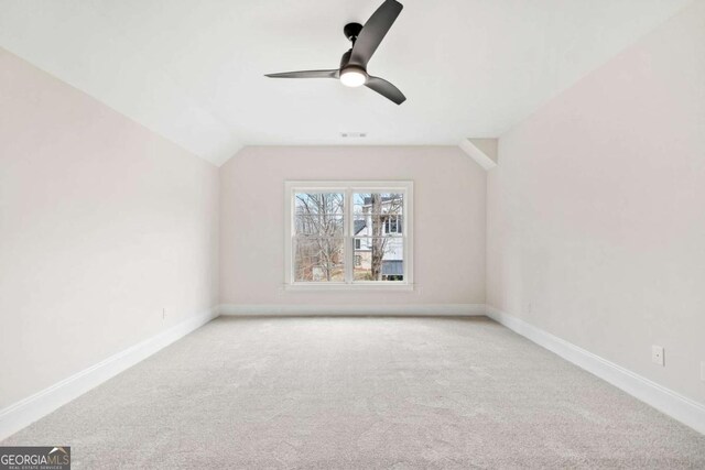 310 Timberview Trl, Alpharetta, GA 30004 - carpeted spare room featuring vaulted ceiling, baseboards, and ceiling fan