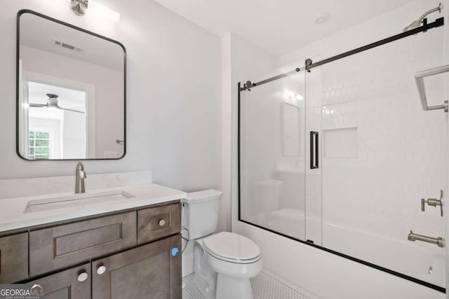 full bathroom featuring visible vents, toilet, enclosed tub / shower combo, tile patterned floors, and vanity