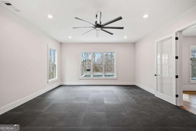 empty room featuring ceiling fan, baseboards, and recessed lighting