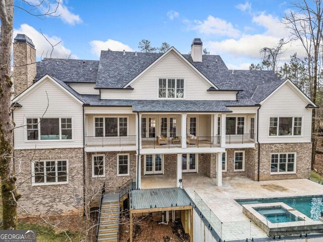 310 Timberview Trl, Alpharetta, GA 30004 - back of property featuring roof with shingles, a chimney, stairway, a balcony, and a patio