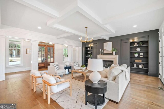 310 Timberview Trl, Alpharetta, GA 30004 - living area with french doors, beam ceiling, built in features, light wood-style floors, and a fireplace