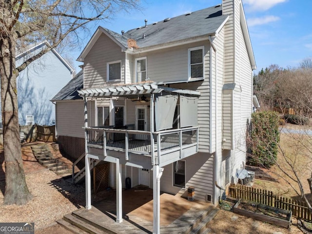 back of house featuring a patio, fence, a wooden deck, and a pergola