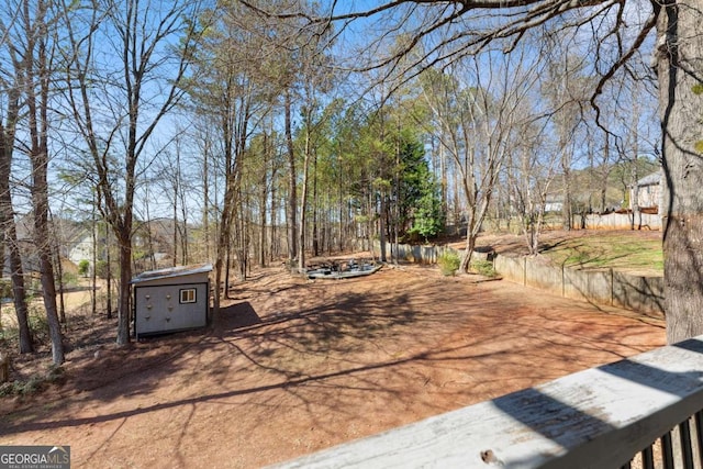 view of yard featuring an outbuilding and a storage shed