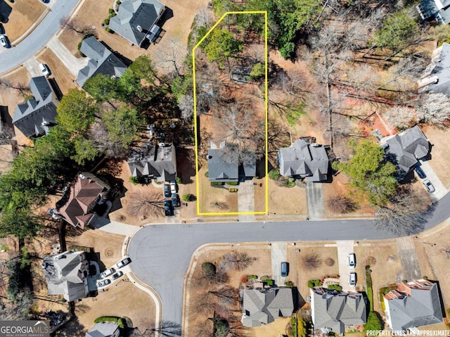 birds eye view of property with a residential view