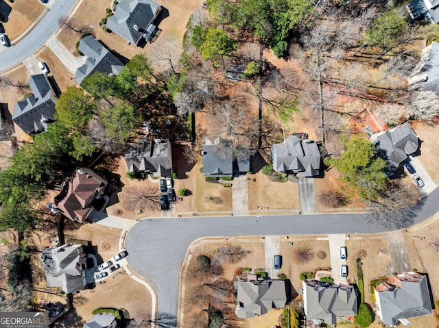 birds eye view of property with a residential view