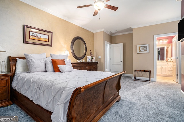 bedroom featuring baseboards, ceiling fan, ornamental molding, ensuite bathroom, and light carpet