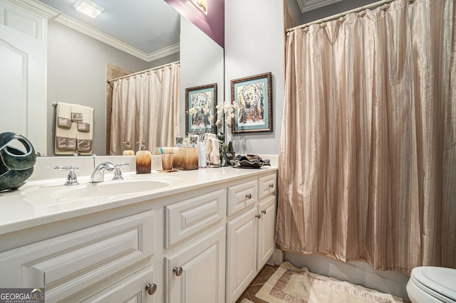 bathroom with visible vents, vanity, toilet, and crown molding