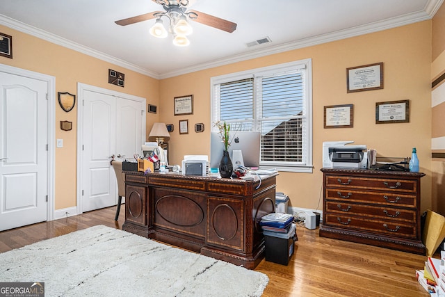 office area featuring visible vents, crown molding, a ceiling fan, and wood finished floors