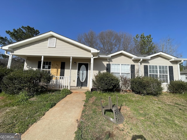 133 Dove Lndg, Social Circle, GA 30025 - view of front facade featuring covered porch and a front yard