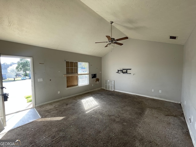 unfurnished living room featuring lofted ceiling, baseboards, visible vents, and a textured ceiling