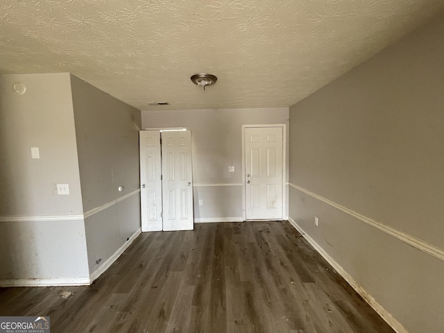 133 Dove Lndg, Social Circle, GA 30025 - interior space with baseboards, a textured ceiling, visible vents, and wood finished floors