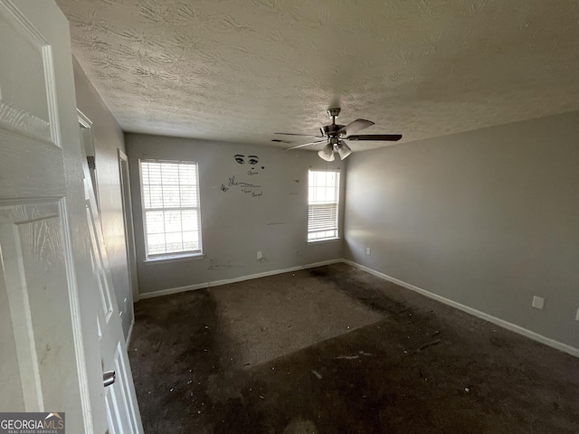 133 Dove Lndg, Social Circle, GA 30025 - spare room with ceiling fan, baseboards, and a textured ceiling