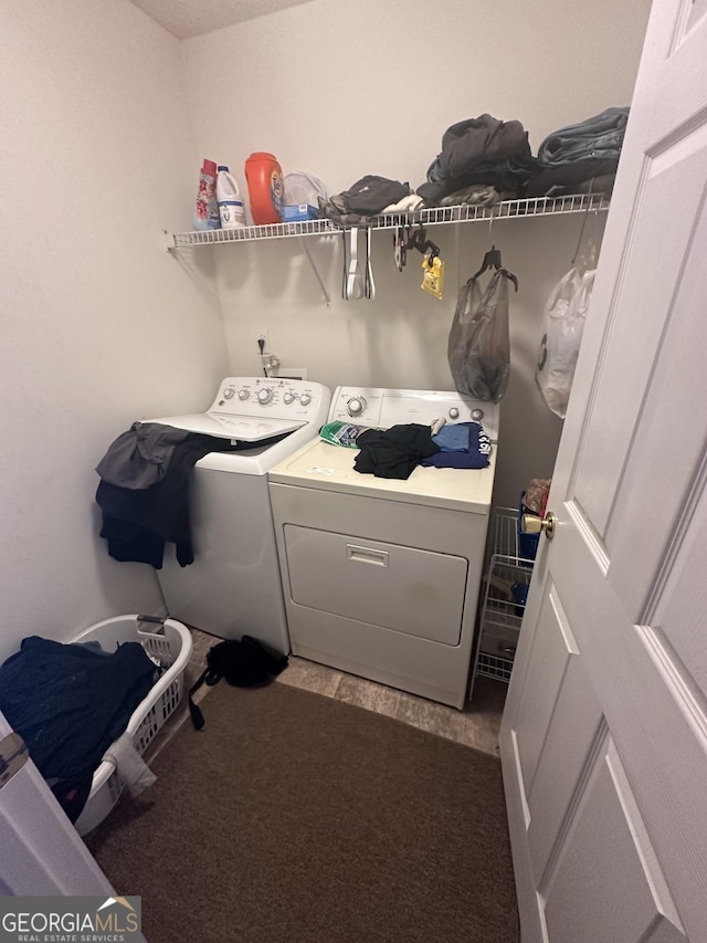 laundry room featuring laundry area and washing machine and clothes dryer