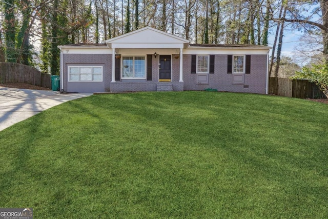 ranch-style house featuring brick siding, driveway, a front lawn, and fence