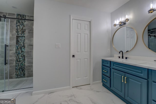 bathroom with marble finish floor, a stall shower, a sink, and baseboards