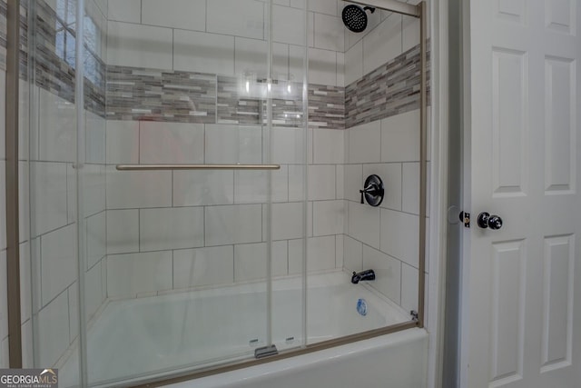 full bathroom with shower / bath combination with glass door