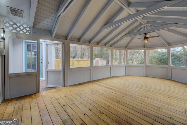 unfurnished sunroom featuring vaulted ceiling with beams, visible vents, and a ceiling fan