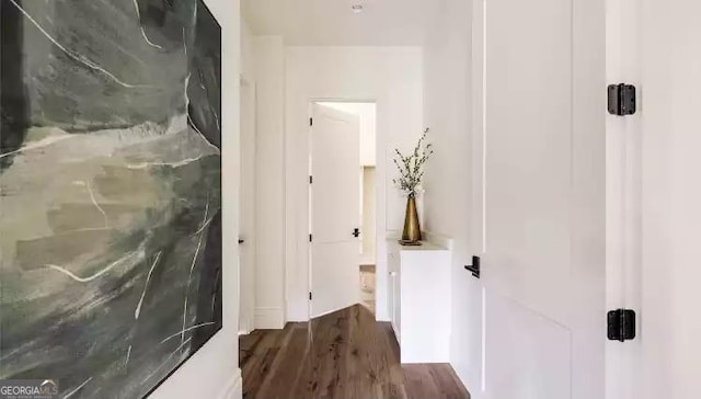 hallway featuring dark wood-type flooring