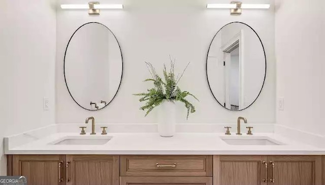 bathroom featuring double vanity and a sink