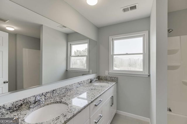 full bath featuring a shower, visible vents, and a sink