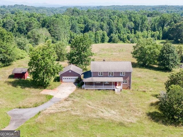 drone / aerial view featuring a view of trees