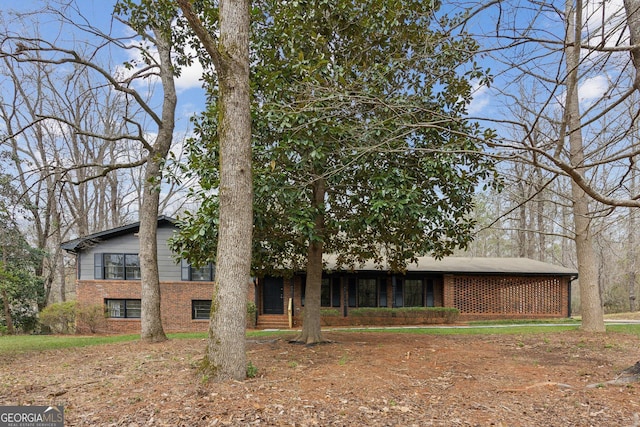 view of front of house featuring brick siding