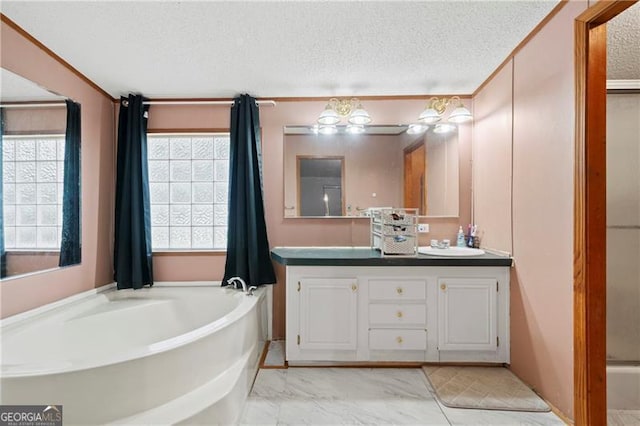 full bathroom featuring double vanity, a sink, a textured ceiling, and a bath