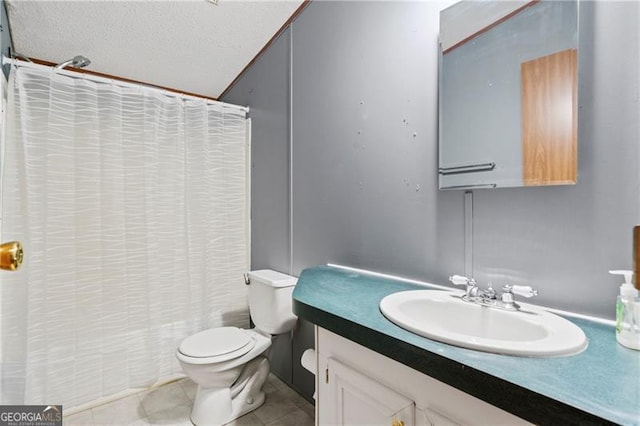 full bath featuring a shower with shower curtain, toilet, vanity, a textured ceiling, and tile patterned flooring