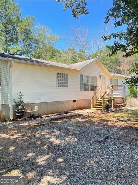 exterior space with crawl space