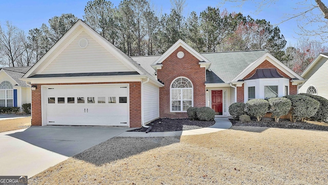 view of front of property with driveway, brick siding, roof with shingles, and an attached garage