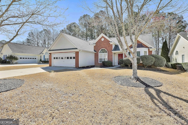 view of front of home with a garage, concrete driveway, and brick siding