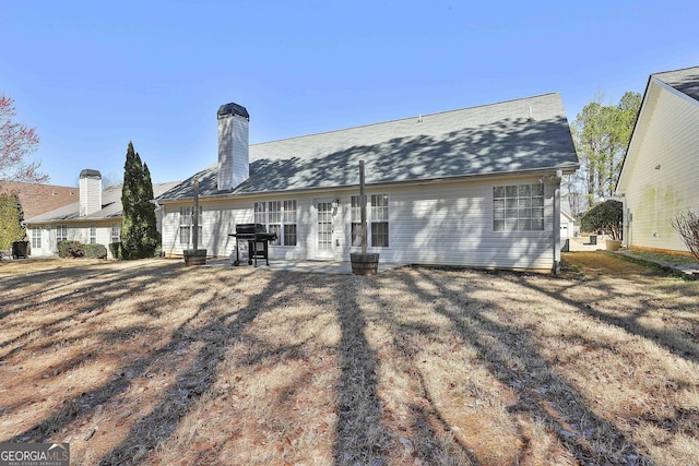 rear view of house with a chimney