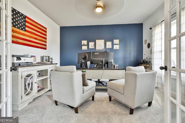 home office with a ceiling fan, french doors, and carpet flooring