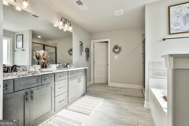 full bath with a garden tub, double vanity, visible vents, a sink, and a shower stall