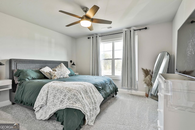 bedroom featuring baseboards, visible vents, ceiling fan, and carpet flooring