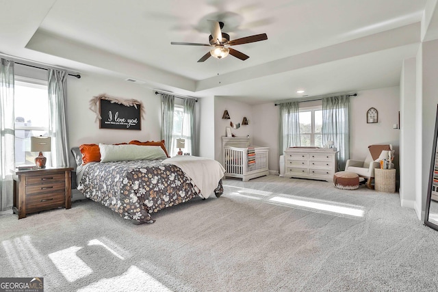 bedroom featuring visible vents, brick wall, baseboards, ceiling fan, and carpet flooring