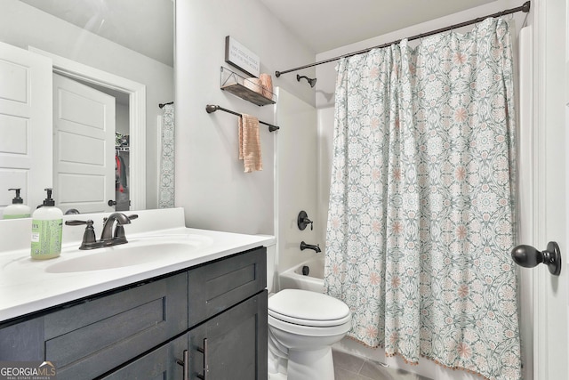 full bath featuring vanity, toilet, tile patterned floors, and shower / tub combo