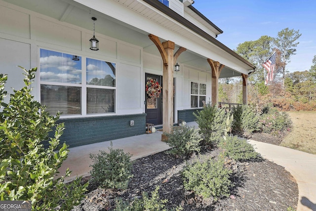 doorway to property featuring covered porch