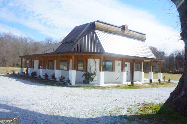 exterior space with metal roof