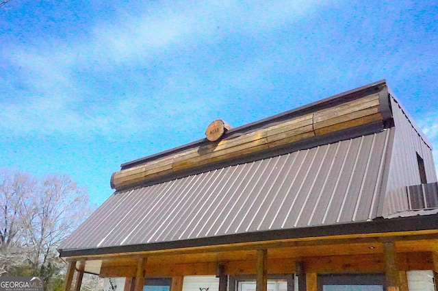 view of side of property with metal roof