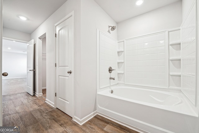 full bath with bathtub / shower combination, baseboards, wood finished floors, and recessed lighting