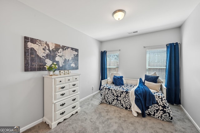 bedroom featuring carpet flooring, visible vents, and baseboards