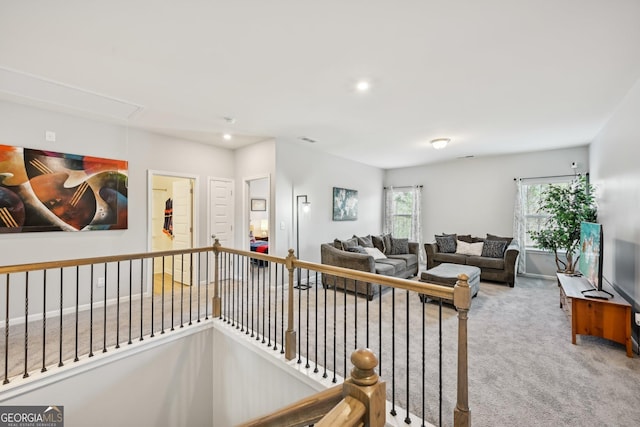 living room with recessed lighting, carpet floors, visible vents, baseboards, and attic access