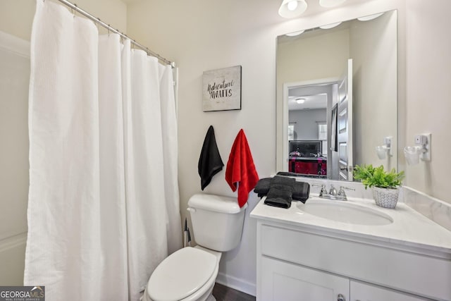 bathroom with vanity and toilet